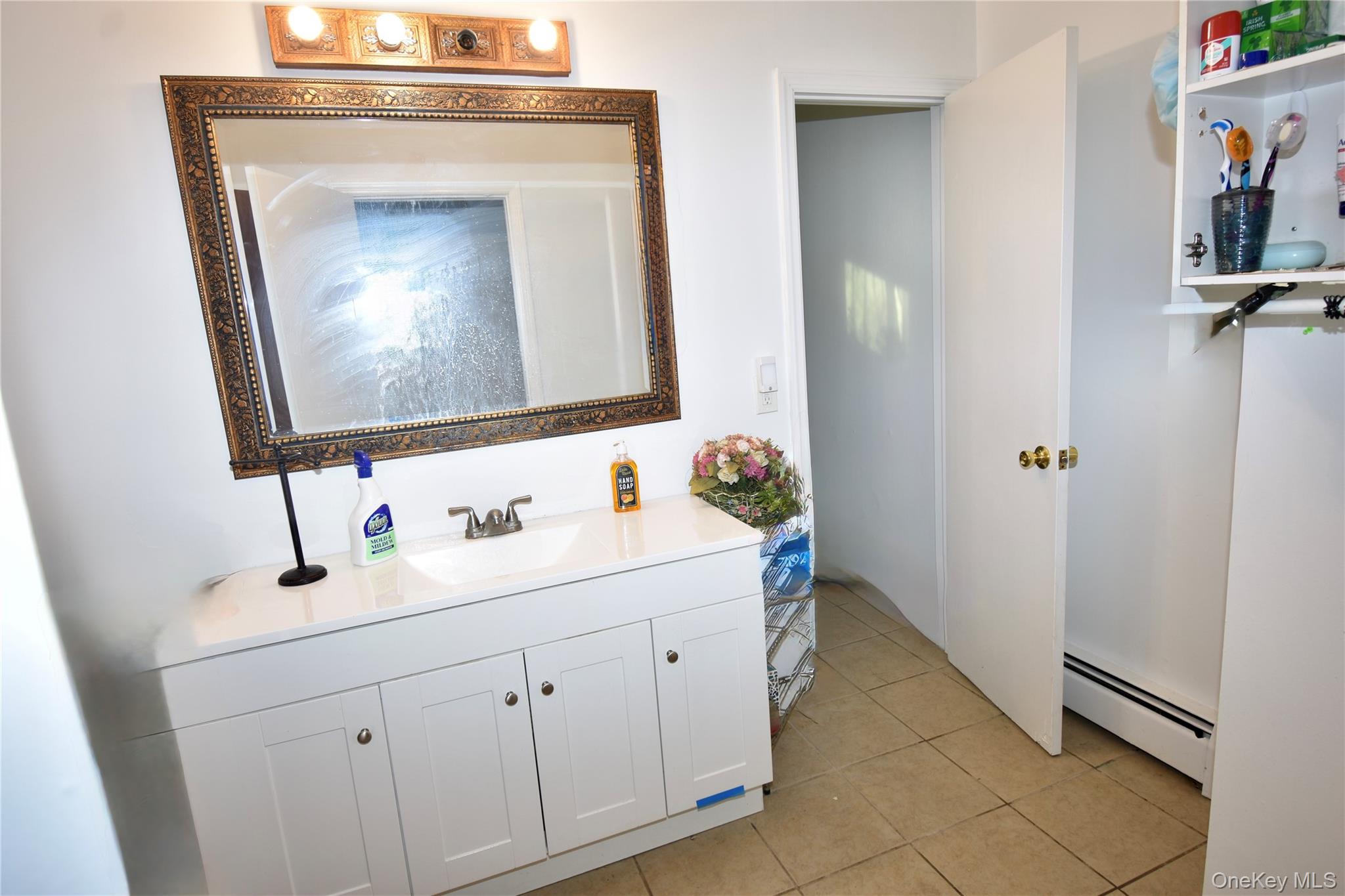 130 Scotland Hill Road Spring Valley, NY 10977 - Photo 22 of 25 2nd level bathroom with view of dressing area leading into addition bathroom space