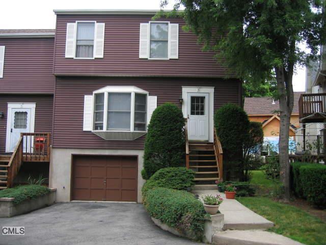 184 Peck Avenue, Unit 3 Greenwich, CT 06830 - Photo 1 of 1 a front view of a house with garden