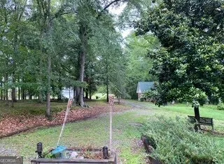 a backyard of a house with lots of green space