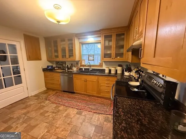 a view of a house with a big yard and large trees
