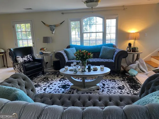 a view of a house with swimming pool and a yard