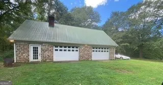 a view of a park with large trees