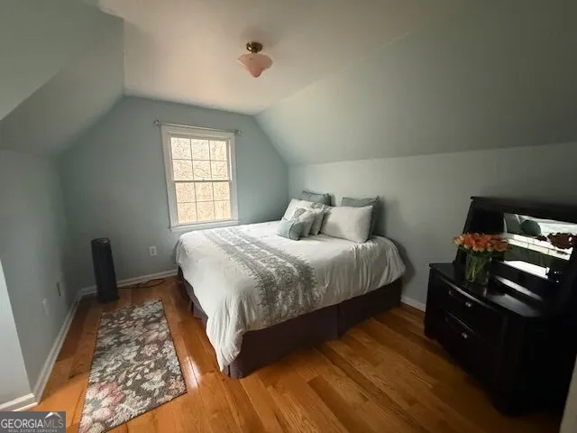 a view of bench sitting next to a road