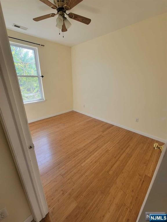 199 Van Winkle Street, Unit 2 East Rutherford, NJ 07073 - Photo 11 of 22 an empty room with windows