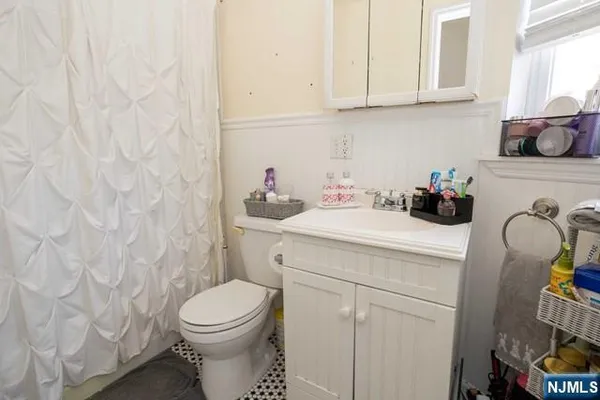 a bathroom with a sink toilet and vanity