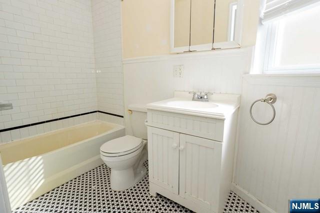 199 Van Winkle Street, Unit 2 East Rutherford, NJ 07073 - Photo 19 of 22 a bathroom with a sink toilet and shower