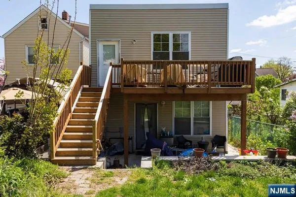 a front view of a house with entryway and stairs