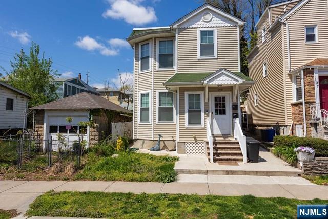 199 Van Winkle Street, Unit 2 East Rutherford, NJ 07073 - Photo 2 of 22 a front view of a house with a yard