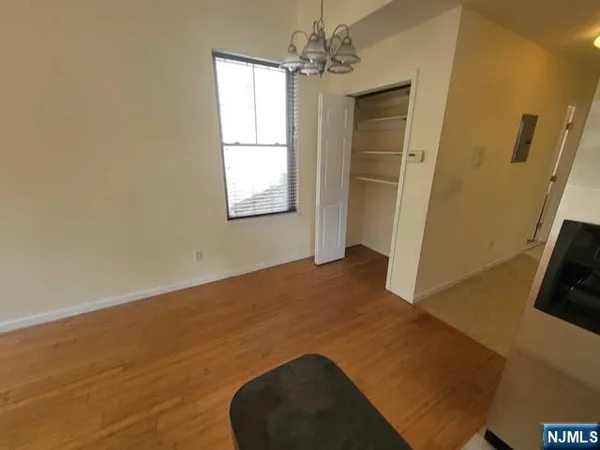 a view of livingroom with hardwood floor and a ceiling fan