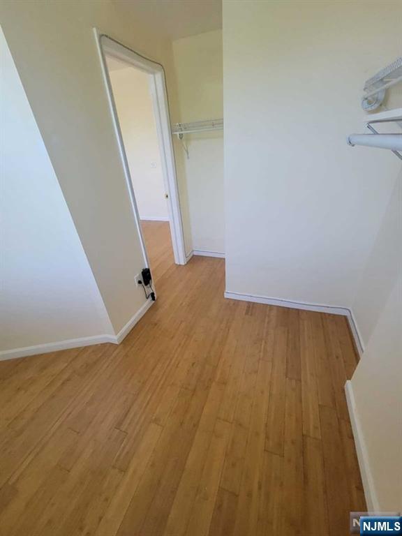 199 Van Winkle Street, Unit 2 East Rutherford, NJ 07073 - Photo 10 of 22 a view of a big room with wooden floor and staircase