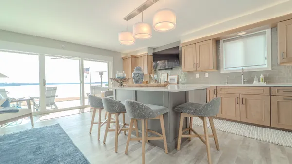 a kitchen with cabinets and stainless steel appliances