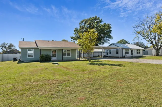 a house with swimming pool in front of it