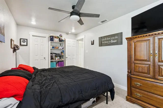 a bed room with furniture and a window