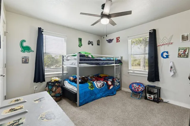 a bedroom with a bed and a tv in it