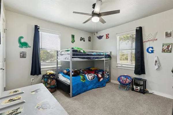 a bedroom with a bed and a tv in it