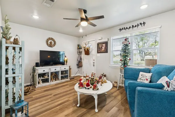 a living room with furniture and a flat screen tv