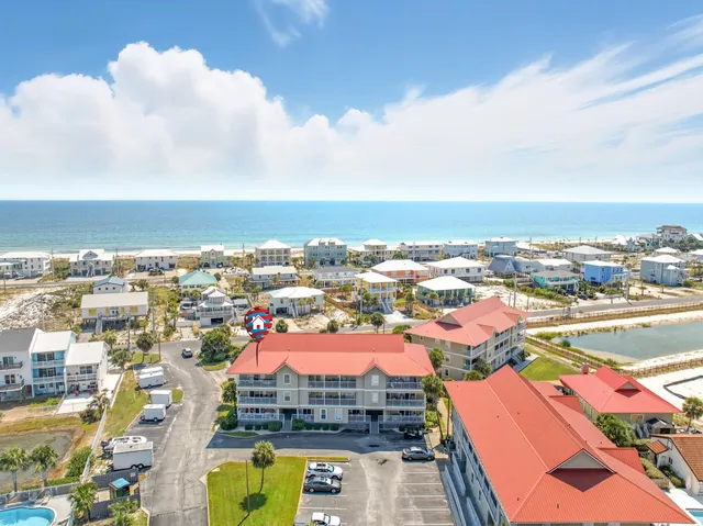 an aerial view of residential houses with outdoor space