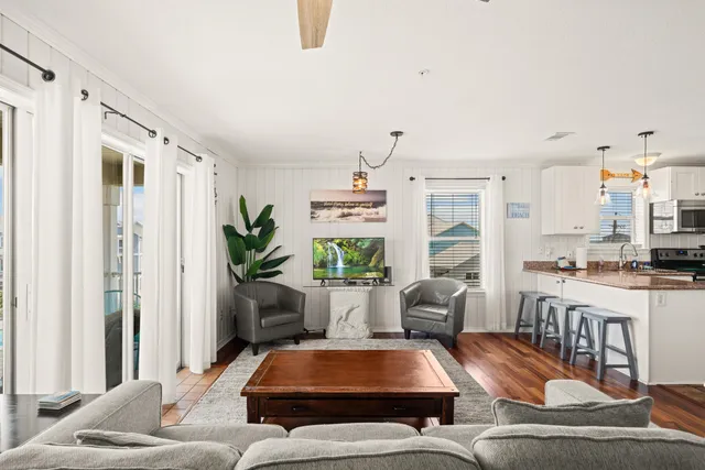 a living room with furniture and a large window