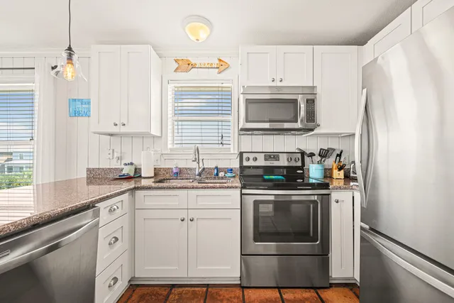 a kitchen with sink and window