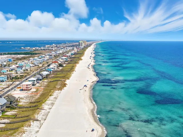 a view of a field with an ocean view