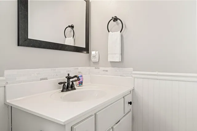 a bedroom with furniture and wooden floor