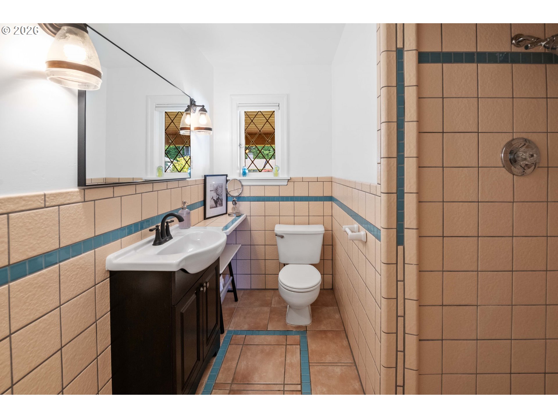 3232 Sunset Boulevard Seaside, OR 97138 - Photo 35 of 48 a bathroom with a sink toilet and shower
