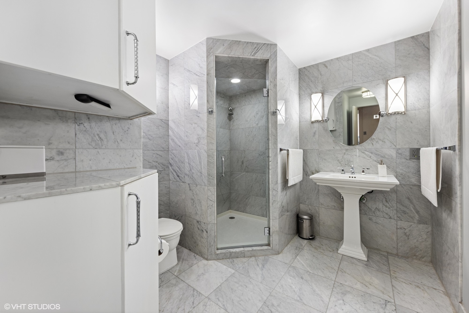 21 West Goethe Street, Unit 8DE Chicago, IL 60610 - Photo 13 of 22 a bathroom with a sink a toilet and shower