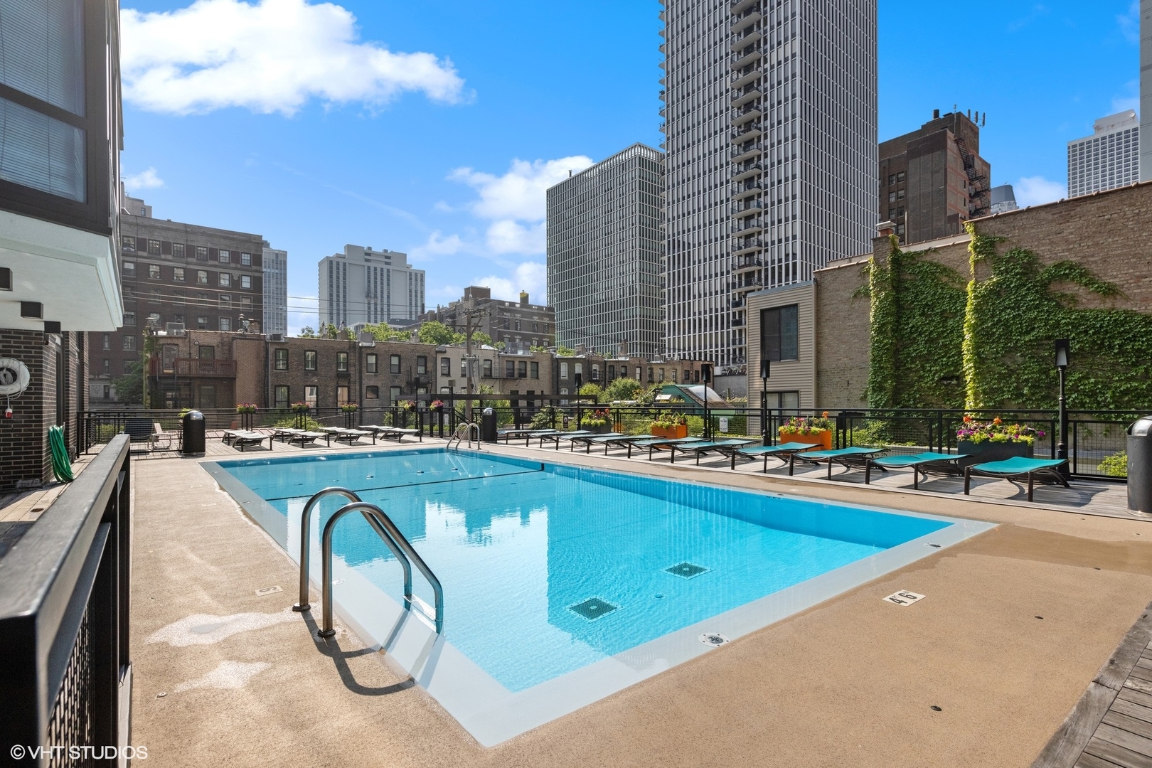 21 West Goethe Street, Unit 8DE Chicago, IL 60610 - Photo 18 of 22 a swimming pool with outdoor seating and yard