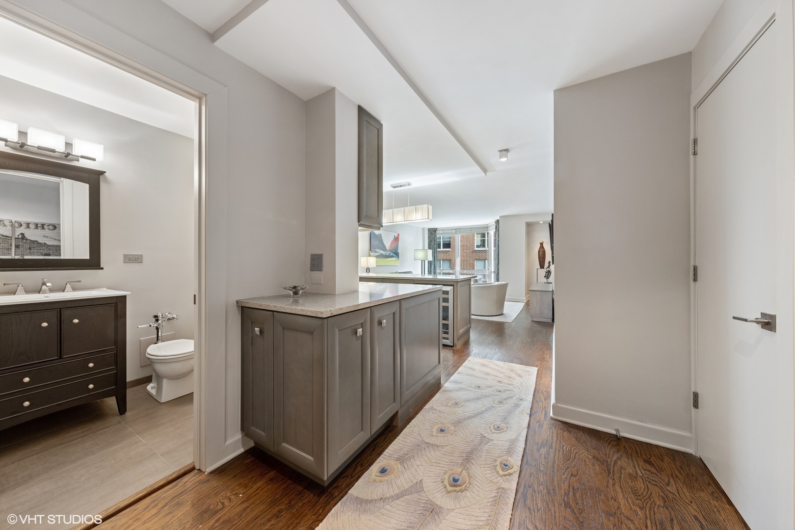 21 West Goethe Street, Unit 8DE Chicago, IL 60610 - Photo 2 of 22 a kitchen with a sink and a refrigerator