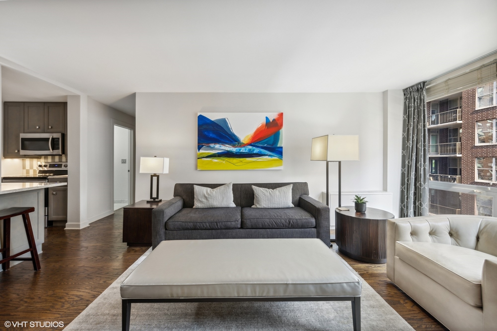 21 West Goethe Street, Unit 8DE Chicago, IL 60610 - Photo 7 of 22 a living room with furniture and a book shelf