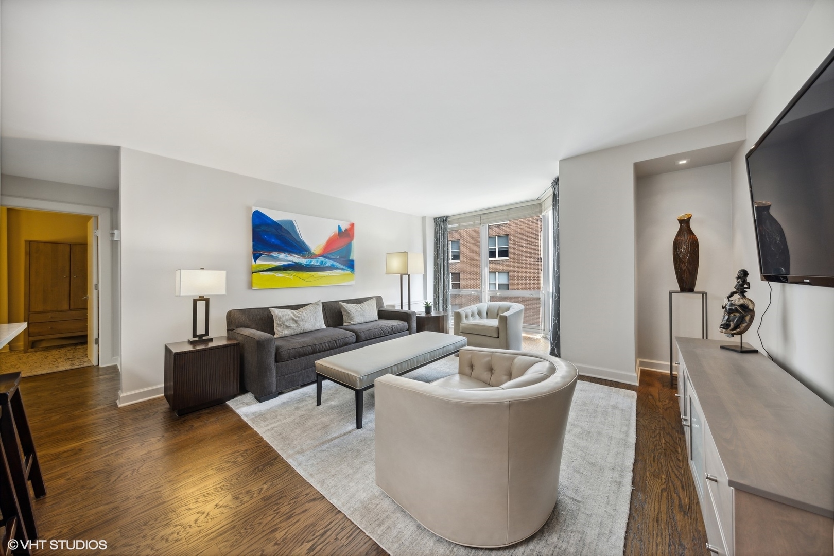 21 West Goethe Street, Unit 8DE Chicago, IL 60610 - Photo 9 of 22 a living room with furniture and a flat screen tv