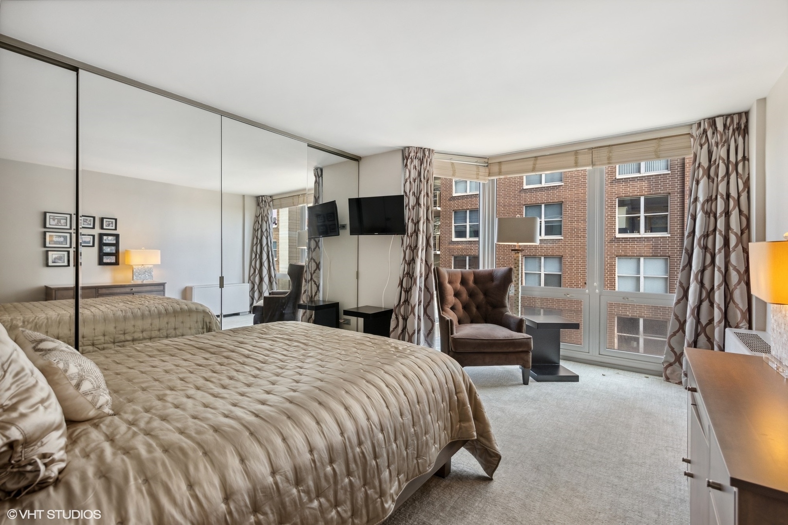 21 West Goethe Street, Unit 8DE Chicago, IL 60610 - Photo 10 of 22 a bedroom with a bed couch and a walk in closet