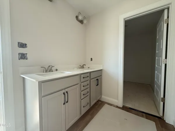a utility room with cabinets washer and dryer