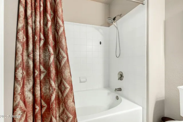 a bathroom with a bath tub