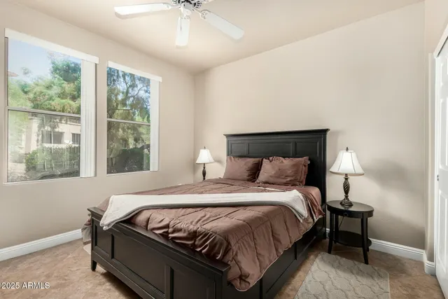 a bedroom with a bed and window