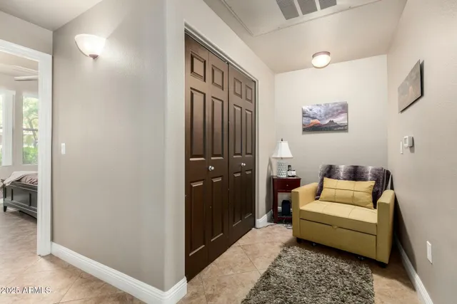 a living room with furniture and a rug