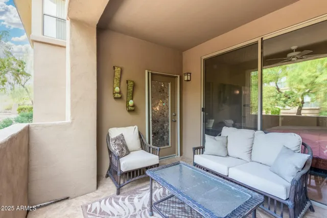a outdoor living space with furniture and a window