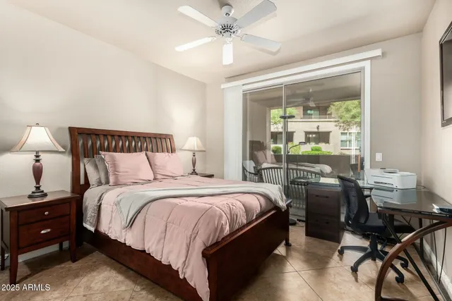 a bedroom with a bed and a table