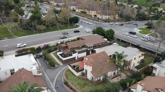 an aerial view of a house with outdoor space