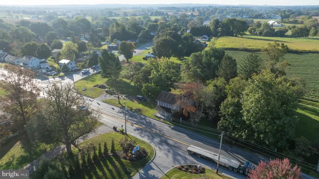 an aerial view of a house with yard swimming pool and outdoor seating