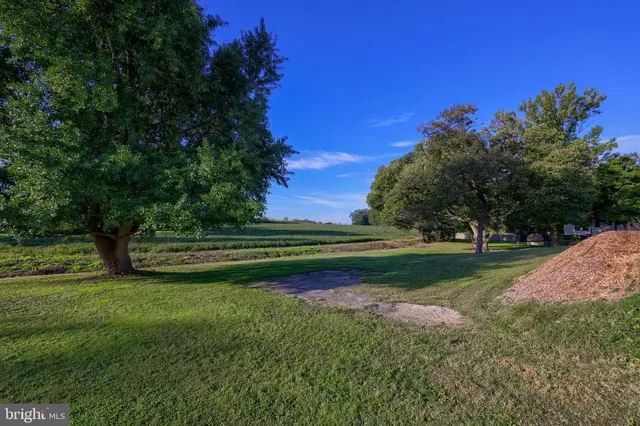 an aerial view of a residential houses with city view