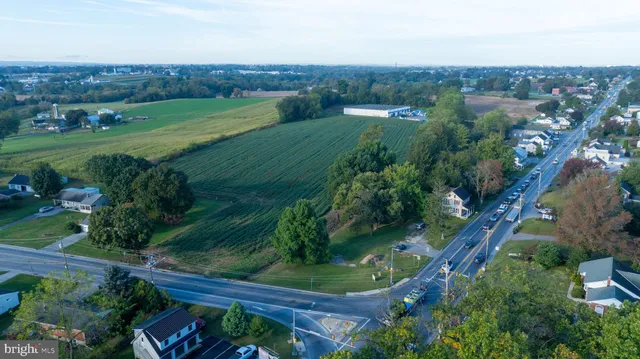 a view of a garden with an outdoor seating
