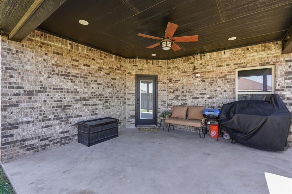 3302 Shelby Road Abilene, TX 79606 - Photo 23 of 29 a living room with furniture and a fireplace
