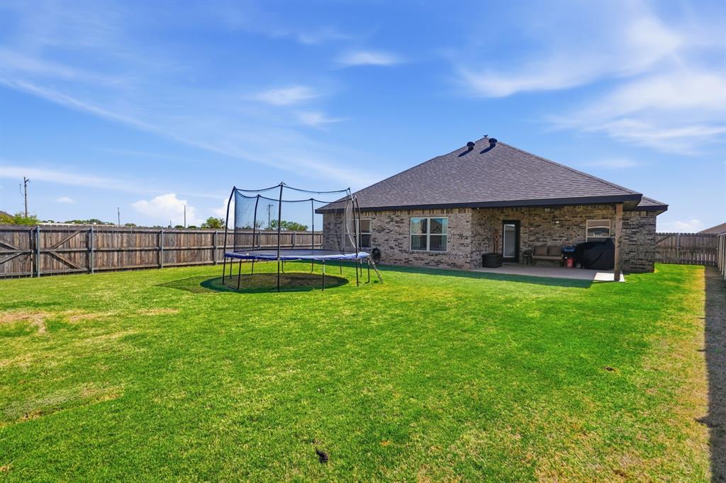 3302 Shelby Road Abilene, TX 79606 - Photo 24 of 29 a view of a house with a backyard