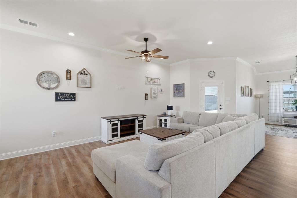 3302 Shelby Road Abilene, TX 79606 - Photo 5 of 29 a living room with furniture and a wooden floor