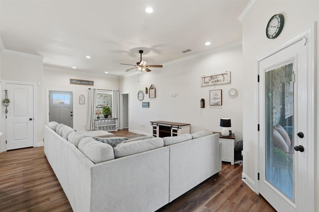 3302 Shelby Road Abilene, TX 79606 - Photo 7 of 29 a living room with furniture and a wooden floor