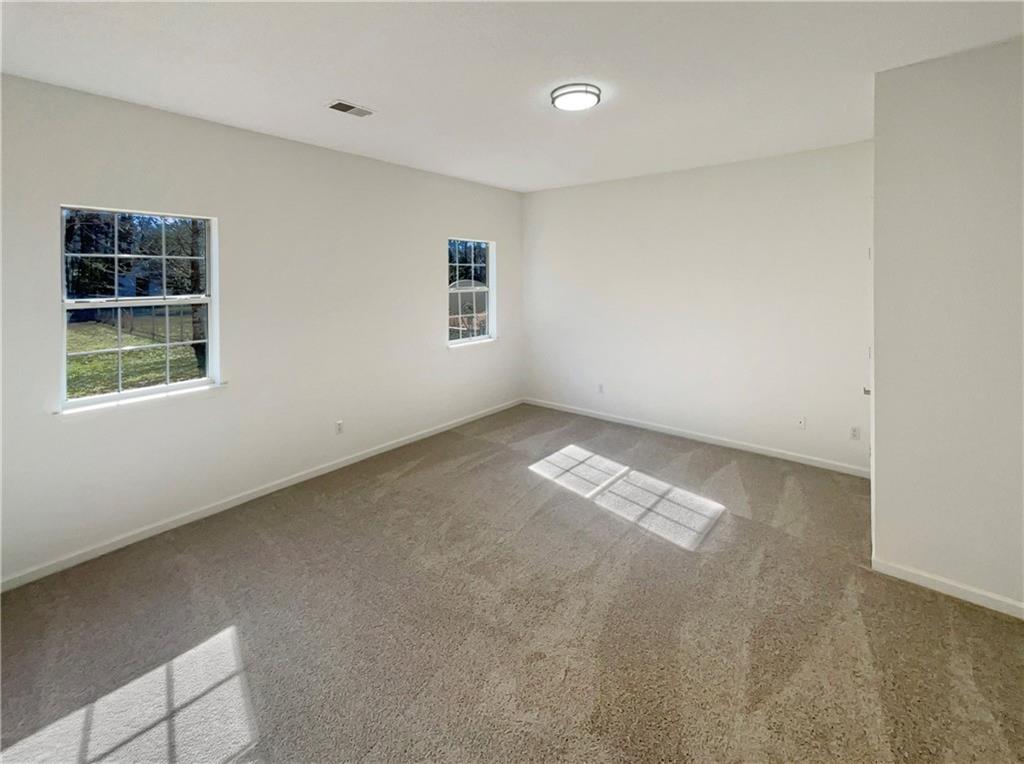 180 Honeysuckle Drive Southeast Calhoun, GA 30701 - Photo 13 of 21 an empty room with windows