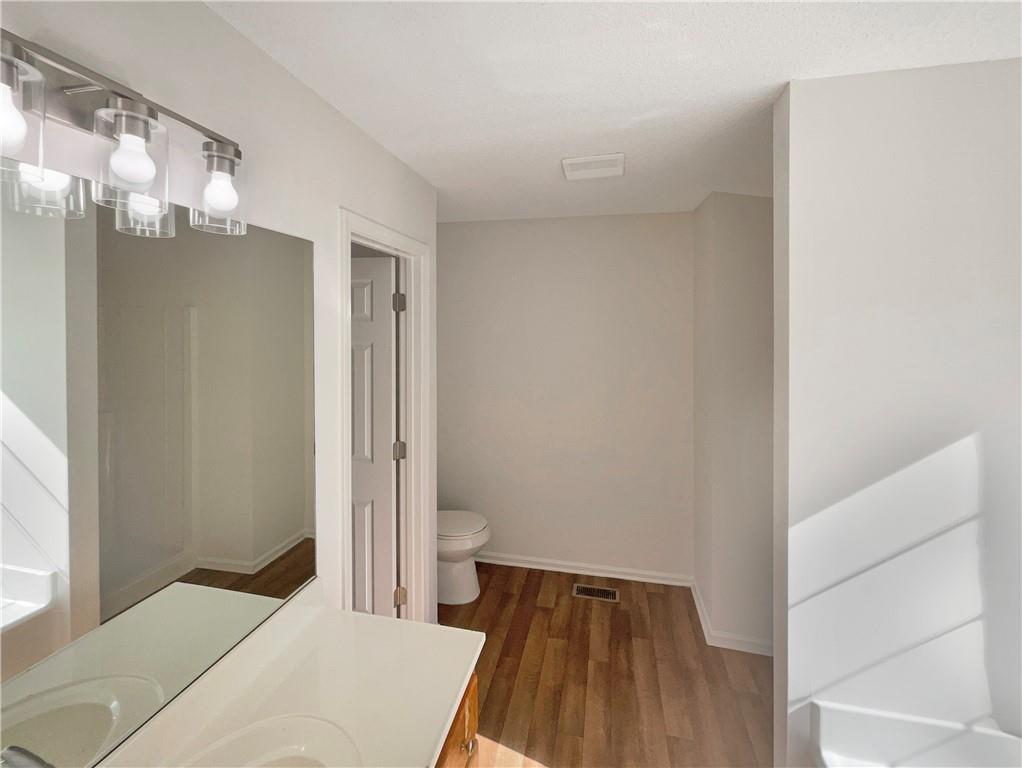 180 Honeysuckle Drive Southeast Calhoun, GA 30701 - Photo 14 of 21 a bedroom with a bed and a dresser