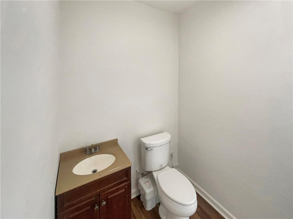 180 Honeysuckle Drive Southeast Calhoun, GA 30701 - Photo 16 of 21 a white toilet sitting next to a bathroom sink