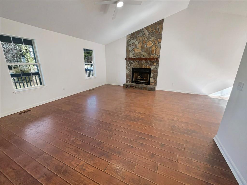180 Honeysuckle Drive Southeast Calhoun, GA 30701 - Photo 3 of 21 an empty room with windows and fireplace